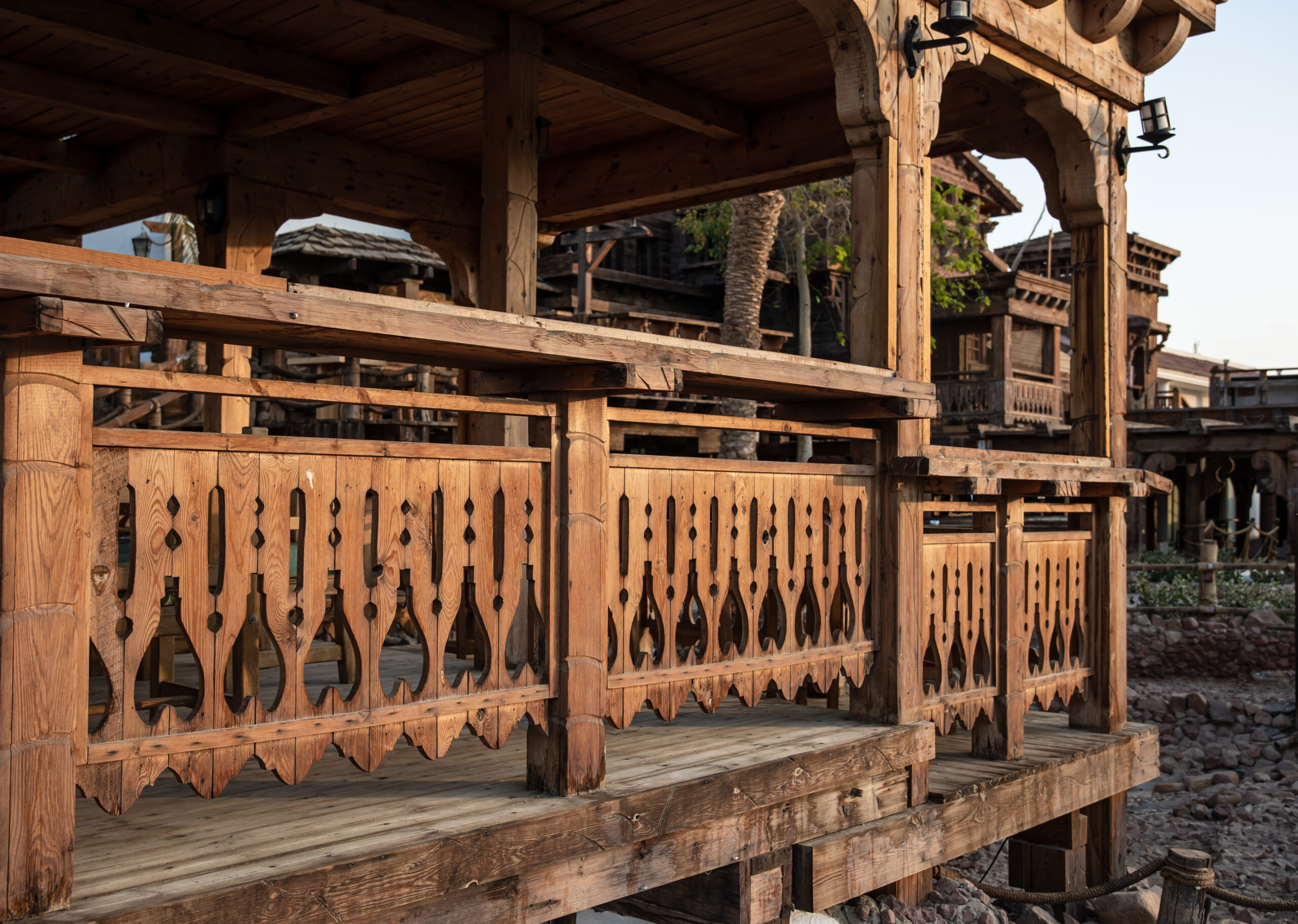 Wooden carved railing of a large old wooden house.